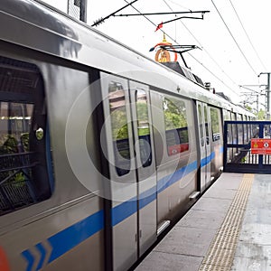 Delhi Metro train arriving at Jhandewalan metro station in New Delhi, India, Asia, Public Metro departing from Jhandewalan station