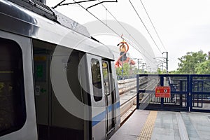 Delhi Metro train arriving at Jhandewalan metro station in New Delhi, India, Asia, Public Metro departing from Jhandewalan station