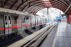 Delhi Metro train arriving at Jhandewalan metro station in New Delhi, India, Asia, Public Metro departing from Jhandewalan station