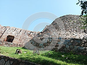 Delhi's old famous Tughlaqabad fort and its thick wall and high wall and photo of main gate photo