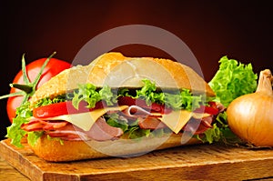 Deli sub sandwich and vegetables photo