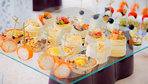 Delicacies and snacks in the buffet. Champagne. Seafood. A gala reception. Banquet.