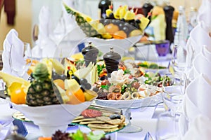 Delicacies, snacks and fruit on the festive table in the restaurant. Celebration. Catering. Banquet table