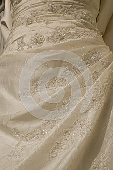 Delicate abstract detail of a wedding dress. Background, texture, embroidered fine lace