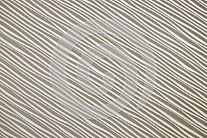 Delicate abstract pattern featuring fine, diagonal wavy lines on a light background, creating a soft and elegant texture