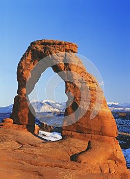 Delicate Arch and the distant La Sal Mountains