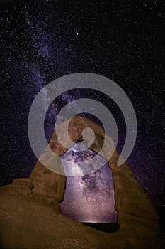 Delicate Arch with the Milky Way and twinkling stars in the backdrop. Arches National Park