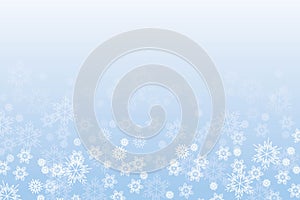 Delicate background with snowflakes. Winter mood. Template for a banner. White snow on blue sky