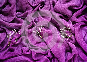 Delicate background with ultraviolet fabric texture with cute white floral ornament, holiday concept and romantic background
