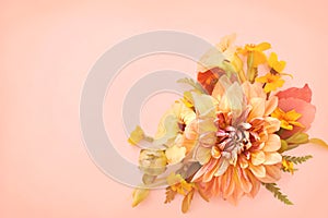 Delicate blossoming orange dahlia and apricot color flowers, blooming festive fall frame background, autumn bouquet floral card