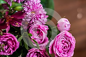 Delicate blossoming pink, white  flowers, blooming roses festive background, flower bouquet pastel image, soft petal. On dark grey