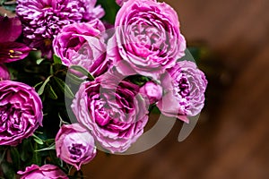 Delicate blossoming pink, white  flowers, blooming roses festive background, flower bouquet pastel image, soft petal. On dark grey