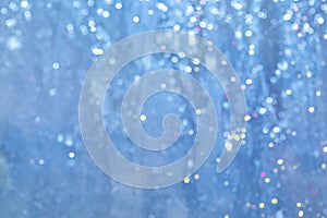 Delicate blue background. Unobtrusive background with bokeh. Misty glitter sparkle