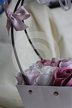 Delicate bouquet of roses in a basket