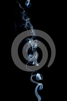 Delicate and bright smoke waves on dark background