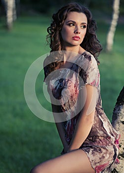 Delicate brunette woman looking at the landscape