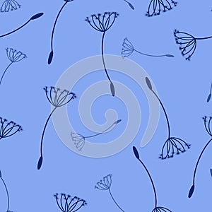 Delicate dandelion seeds on a light blue background