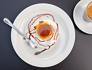 Delicate flan dessert is custard creamy delicacy made from milk, eggs and sugar.