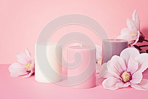 Delicate flower scented candle over pastel pink background