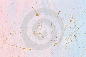 Delicate pink and blue background with gold paint splashes. Place for your design