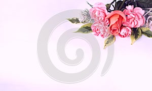 Delicate pink roses on a white background. Festive flower arrangement.