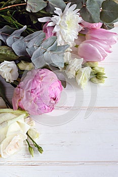 Delicate romantic bouquet for a gift. Huge pink peonies and white roses on a white background.