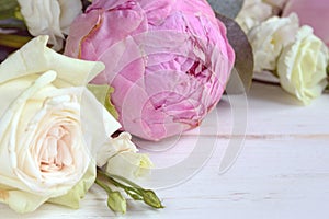 Delicate romantic bouquet for a gift. Huge pink peonies and white roses on a white background.