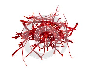 Delicate saffron threads, plucked from crocus flowers and dried. Isolated on white background