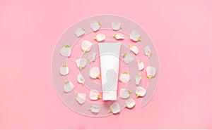 Delicate skin care cosmetic feminine flatlay. Top view Creative composition of face cream ,bottles and jars with cosmetic and