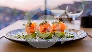 Delicate smoked salmon with avocado purÃÂ©e, a sophisticated appetizer