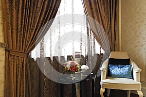 Delicate sofa and the table in the bedroom