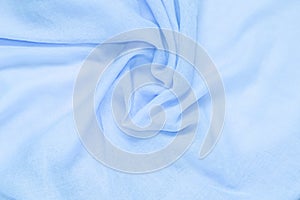 Delicate soft and wrinkled fabric blue color background texture