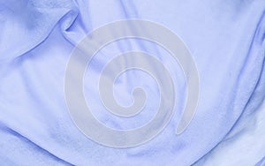 Delicate soft and wrinkled fabric blue color background texture