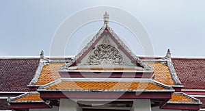 Delicate Thai art at roof top of Buddhist temple