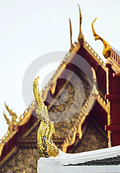 Delicate Thai art at roof top of Buddhist temple in Bangkok, Tha