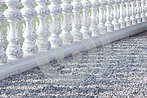 Delicate white blue fence baluster traditional asian style diagonal composition