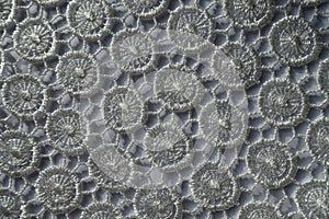 Delicate white lacy fabric from above