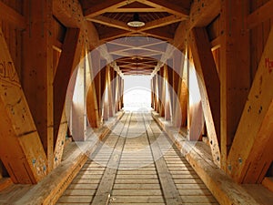 Delicately lighted wooden structure of bridge