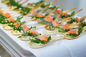 Delicates, appetizer filling with red fish and greens. Catring service.