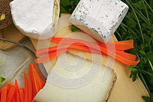 Delicatessen cheese on cut board