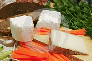 Delicatessen cheese on cut board