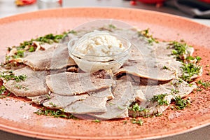 Delicatessen restaurant dish of thinly sliced boiled beef tongue