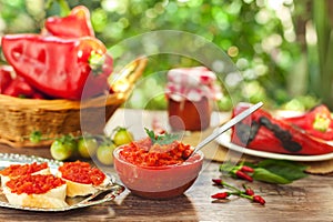 Delicious ajvar in bowl with spoon
