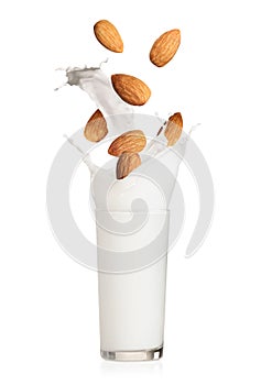 Delicious almond milk and nuts on white background