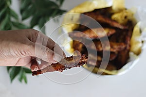 Delicious anchovy fish fry, crispy and golden brown, served on a plate with garnish photo