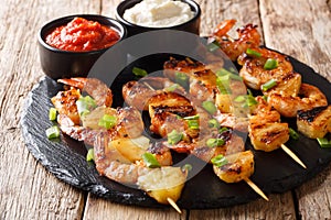 Delicious appetizer of kebab grilled shrimp and pineapple slices
