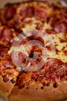 Pepperoni pizza closeup with selective focus
