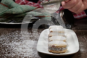 Delicious Argentinian cookies cornflow alfajores with cream dulce de leche close-up . White vanilla macaroons on white