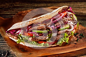 Delicious Asian doner kebab on toasted tortilla