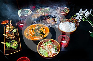 Delicious Asian food - A collection of different Asian dishes on black surface